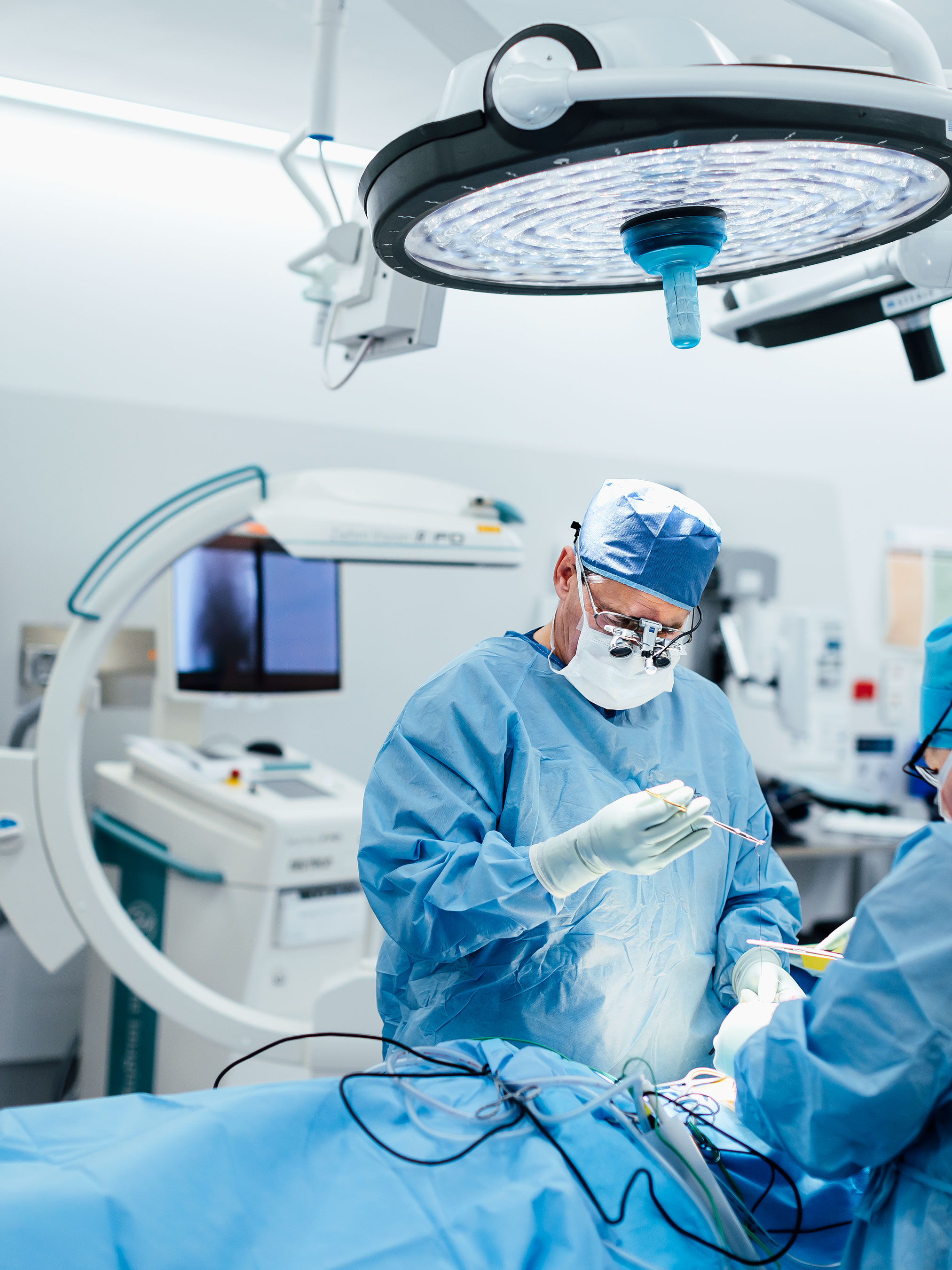 Timothy Steel, a spine surgery expert, is performing surgery at St Vincent